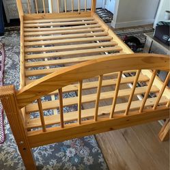 Wooden frame twin size bed 38 inches  wide by 75 inches long
