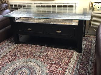 solid wood table with glass top