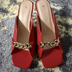 Olivia + Katie red faux leather square-toe block heel mules with a gold-toned chain
