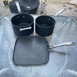 Set a three Kirkland signature square griddle, and two pots