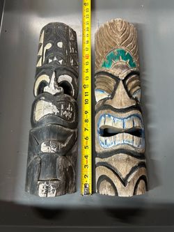 Four wooden outdoor tiki mask set