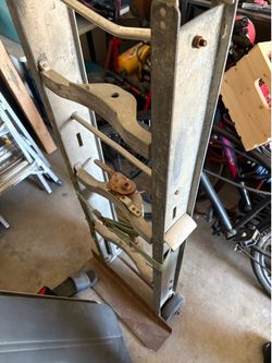 Old aluminum dolly cart with strap