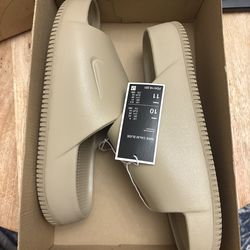 Nike Men's Calm Slide in the khaki colorway.