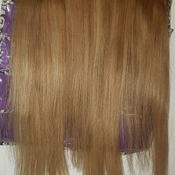 Blonde hair extensions
