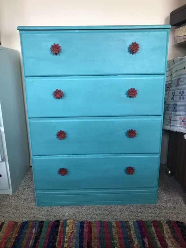 Vintage turquoise dresser with red accent knobs