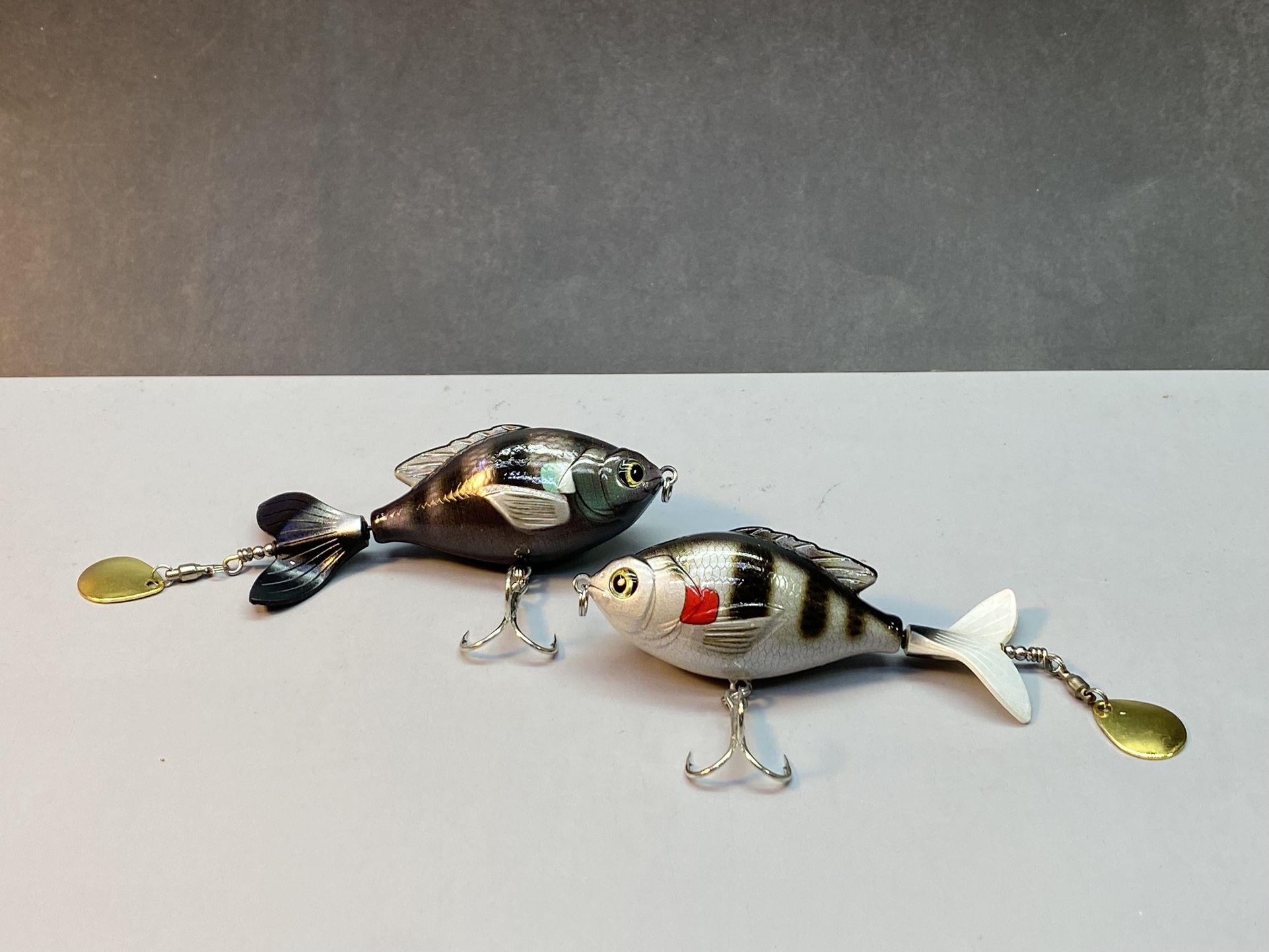 (4)  HENGJIA. Two black two white. Per set. Topwater Fishing Lures Artificial Crankbait Hard Swimbaits Hooks with Wobbler. Floating Rotating with Sequ