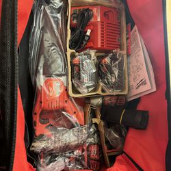 Milwaukee M18 Cordless Combo Set (4 Tools) with Two 3 Hr Batteries, Charger, and Tool Bag.  Tools Include: Hammer Driver Drill, Impact Driver, Sawzall