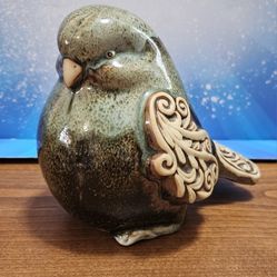 Green pottery bird scroll wings and tail darker glaze on wings tail