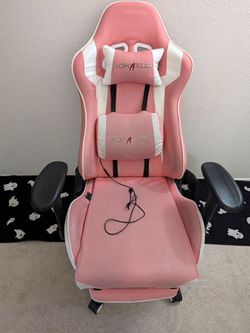 Pink gaming chair with foot rest