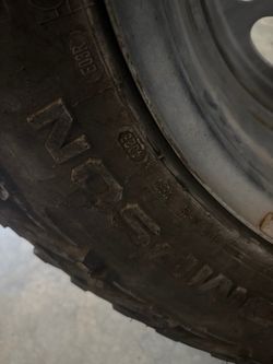 Used All-Terrain Tire on Steel Rim