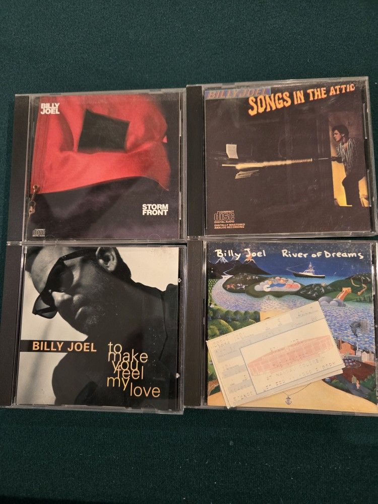 Cds Billy Joel and Jack Johnson and Donovan Franenreiter