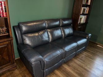 Reclining navy blue leather sofa and lounge chair