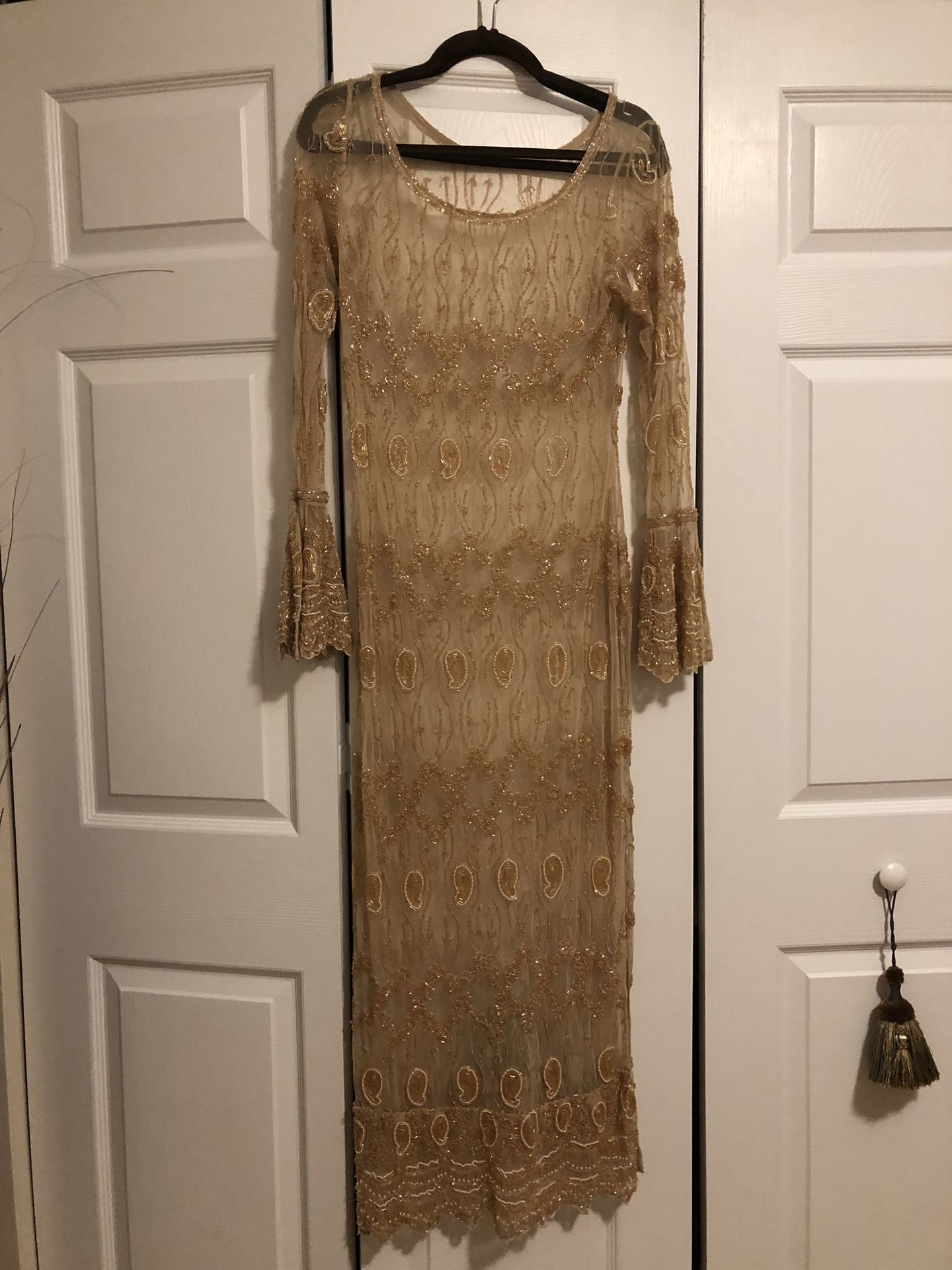 Beautiful beaded dress. Gold . Size 10/12