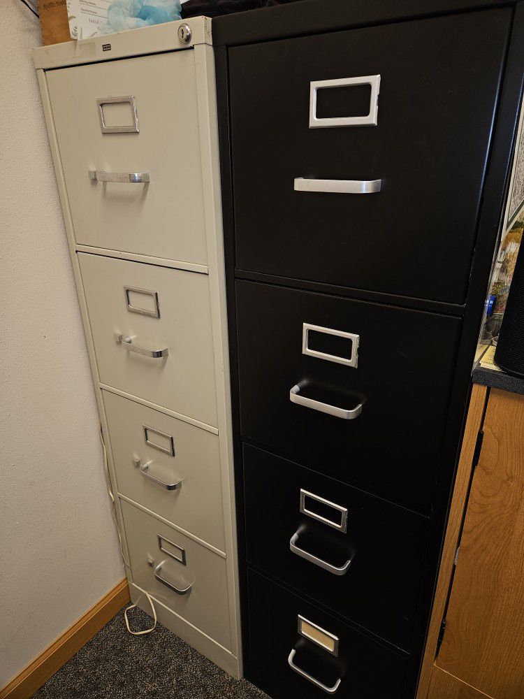 Four Drawer Filing Cabinets In Good Shape Used. One Has A Key One Does Not