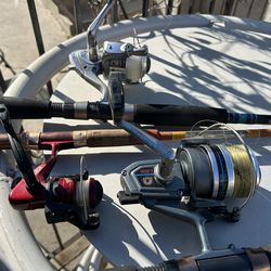 Three fishing rods and reels $100