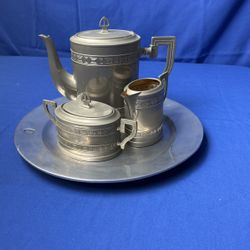 Silver plated, teapot, and sugar and creamer
