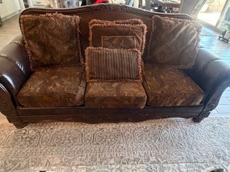 Traditional Brown Paisley Sofa with Wood Frame and fire place and coffees tables