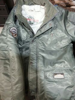 Authentic green army Timberland jacket. Size L (16-18). New. $25