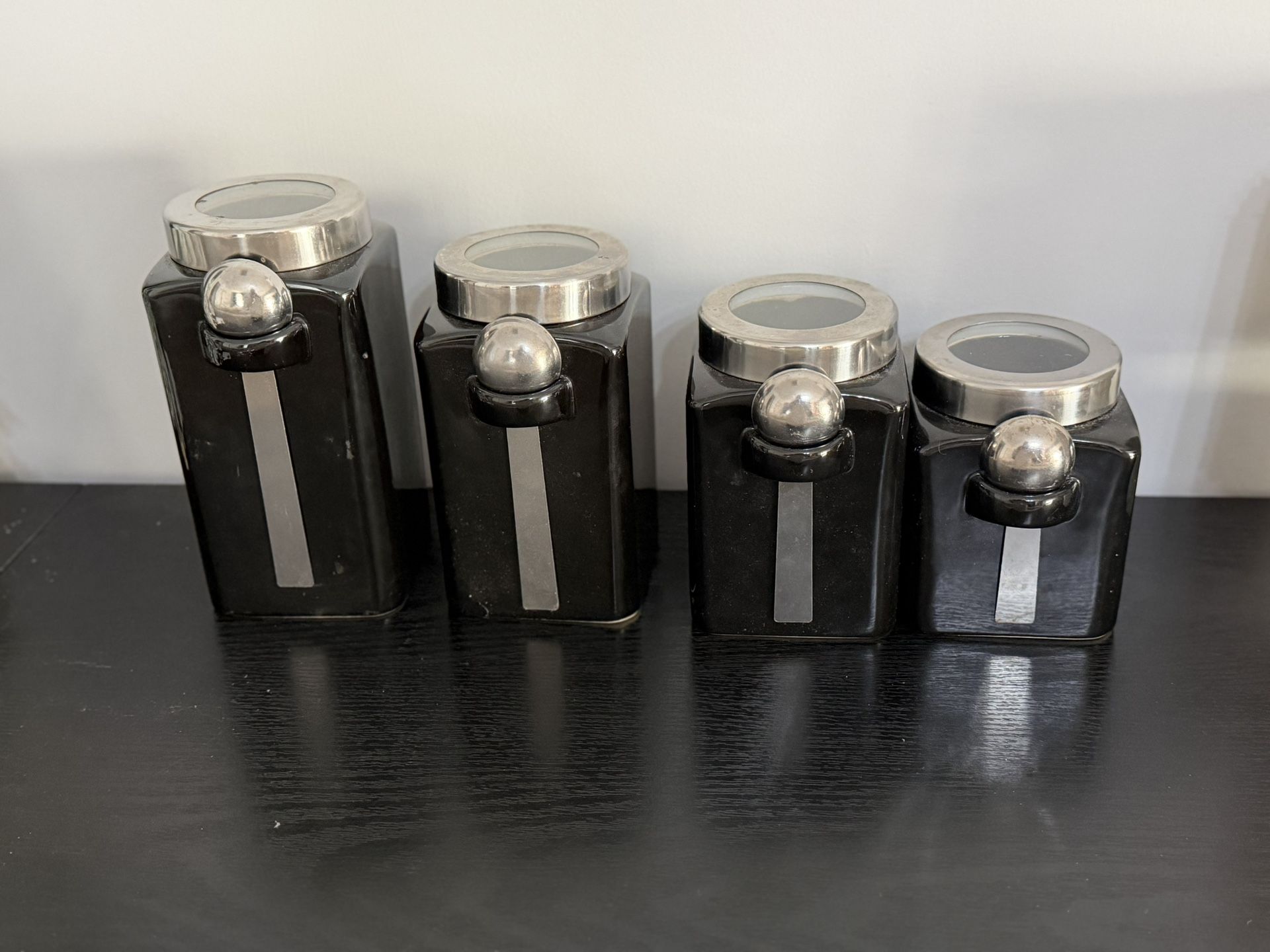 Set of 4 Ceramic canisters with spoons