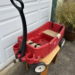 Step 2 Wagon in good shape.  Holds 2 small kids and some stuff. Wheels and doors work well.  $50 or best offer. Cash for Venmo, meet in person somewhe