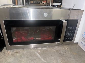 GE Stainless Steel Over-the-Range Microwave. Used