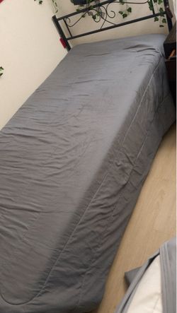 Twin Bed with Black Metal Headboard