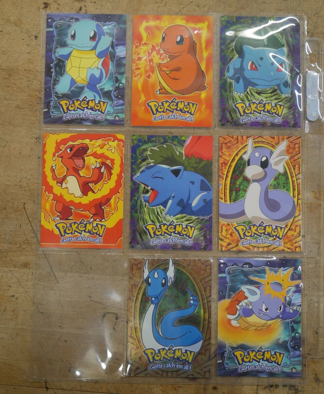 LOT 8 POKEMON CARDS GOTTA CATCH 'EM ALL STAGE 1 #01 BULBASAUR E1 0F 12; #04 CHARMANDER E4 0F 12 ; #07 SQUIRTLE E7 OF 12 ; #147 DRATINI E10 OF 12 AND S