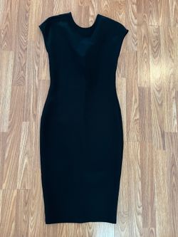 FREE.  Simple elegant stretchy black dress.  Long zipper in back that needs to be repaired/replaced.