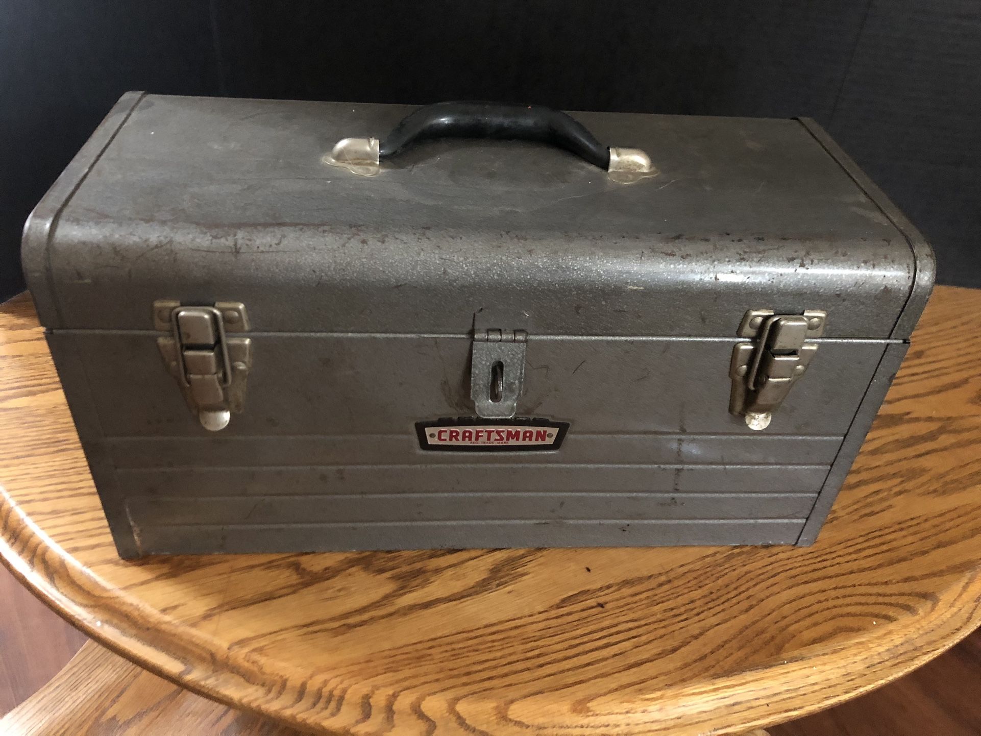 Vintage metal craftsman tool box with miscellaneous tools, mostly craftsman.