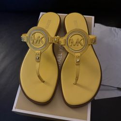 Michael Kors Aubrey Cutout Leather T-Strap Sandals in yellow