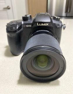 Panasonic Lumix GH5 Mirrorless Camera Kit with Sigma 16mm f/1.4 DC DN Contemporary Lens and a Dummy Battery Power Supply Adapter