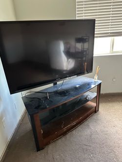 Tv with entertainment stand