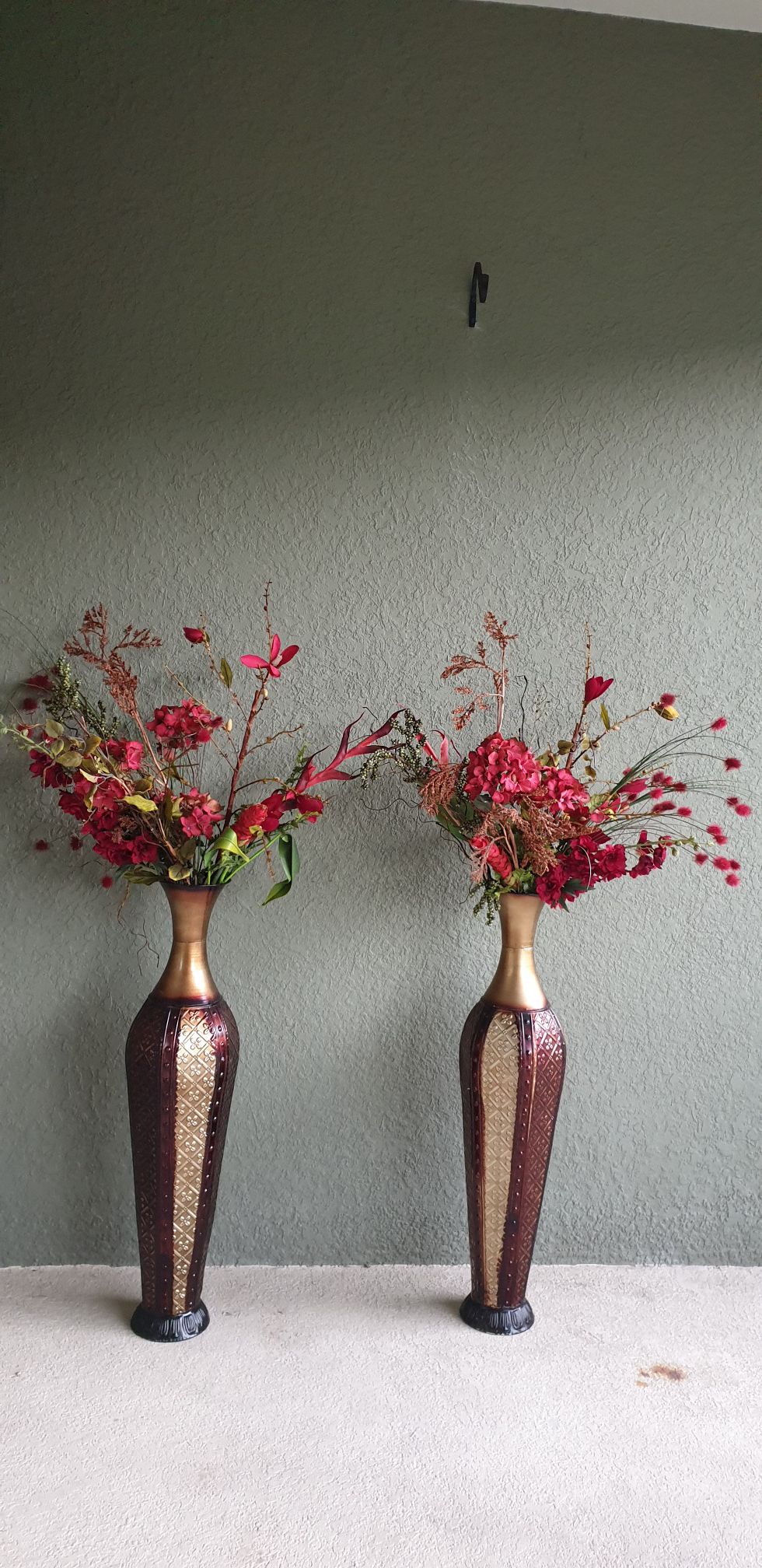 Two decorating vases with flowers