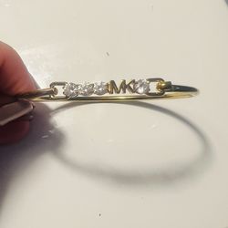 Michael Kors gold toned bracelet with clear stones