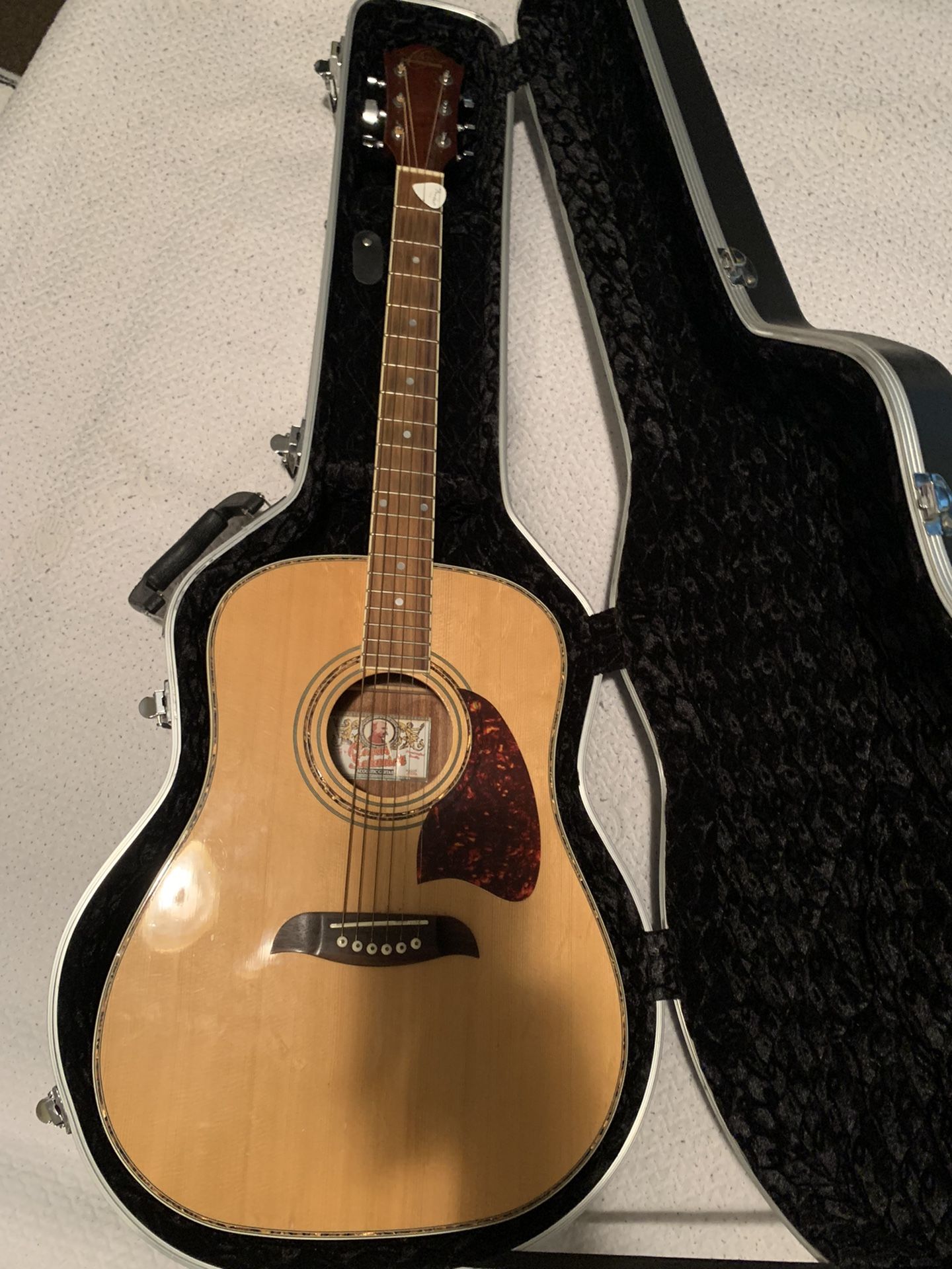 Oscar Schmidt acoustic guitar.