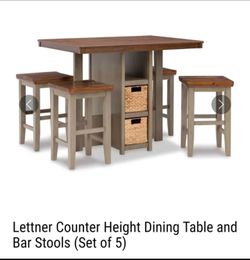 Counter height dining table and 4 stools, cushions included.  Also baskets.