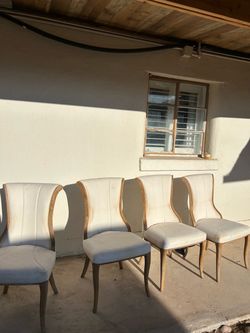 4 white chairs