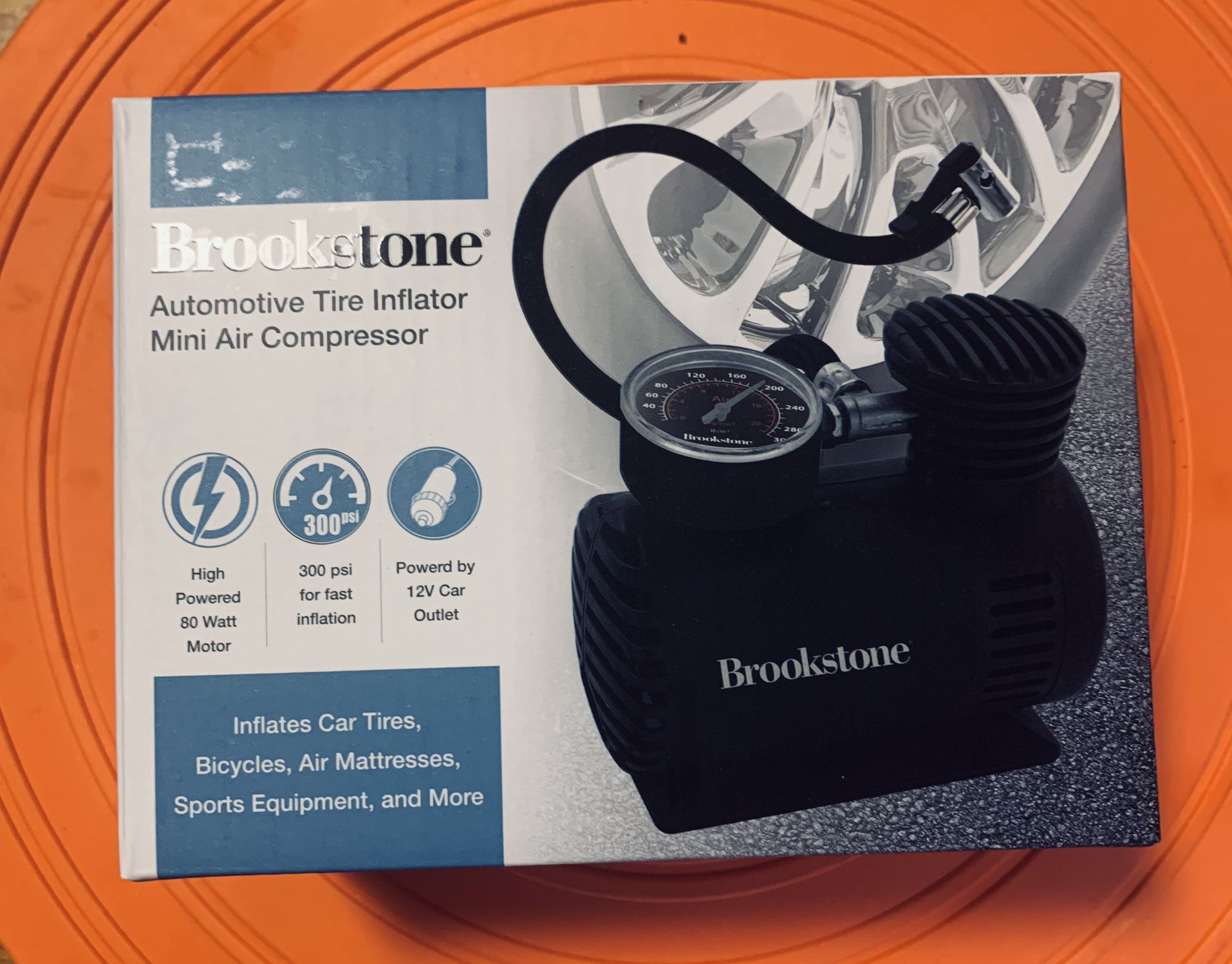 BROOKSTONE  AUTOMOTIVE TIRE INFLATOR MINI AIR COMPRESSOR  - NEW AND SEALED IN BOX 80 WATT HIGH POWERED 300 PSI POWERED BY 12 V car OUTLEET