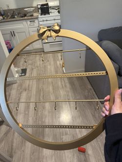 Gold bow jewelry holder