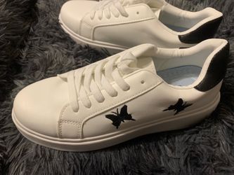 Woman’s butterfly shoes