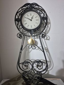 Cast iron wall clock