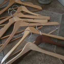 (9) Solid Wooden Hangers; Some With Pants Hangers Attached; All For $6.00.
