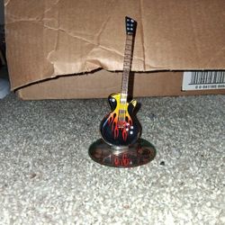 Glass Baron Smokin' Hot Guitar" figurine. 