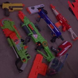 7 Nerf Guns With Bag Of Darts And 3 Magazines 