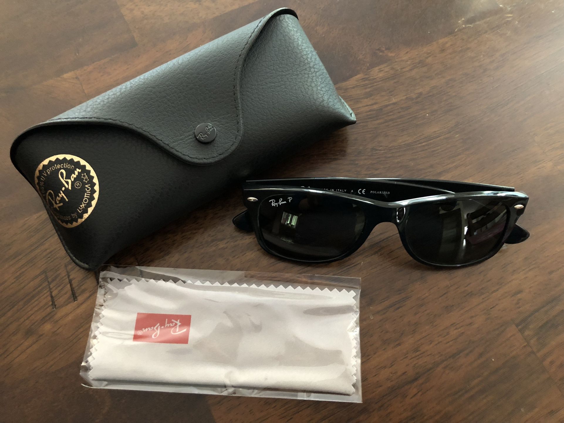 Rayban polarized Women’s sunglasses new wayfarer, brand new. Includes case and cloth. Never worn, guaranteed authentic. Retail $200.