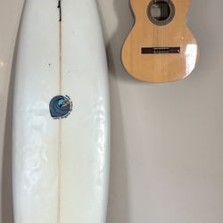 7’4 mid length thruster, pin tail By Angelo Ferrara