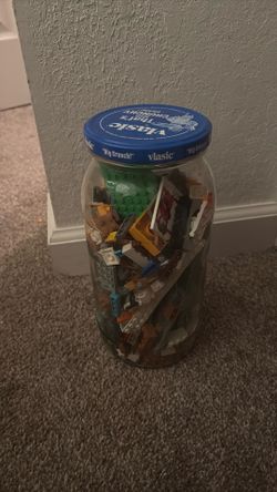 Tall pickle jar of Lego pieces
