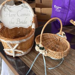 Here comes the bride, and the other side is just married beautiful basket with starfish, smaller flower girl basket with paper roses