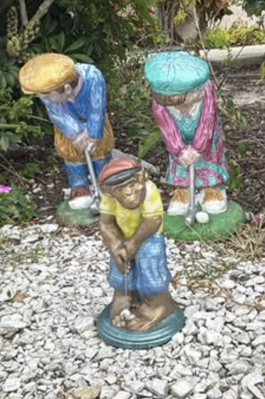 three cement golfing statues. extremely heavy and cannot move them.