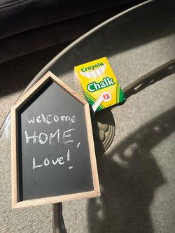 Box a chalk and house shaped chalk board. About 7-8 inches tall.